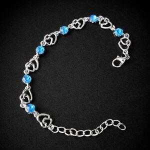 Silver Heart Link Bracelet with Blue Crystal Accents